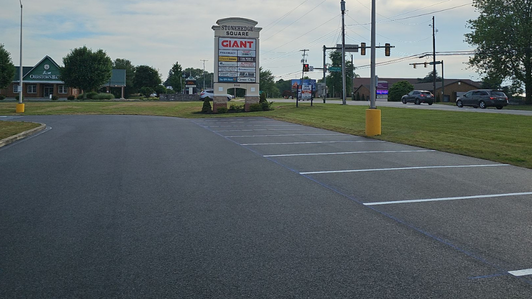 Parking lot for Stonehedge Square shopping center. Asphalt is new and parking stalls are recently striped.