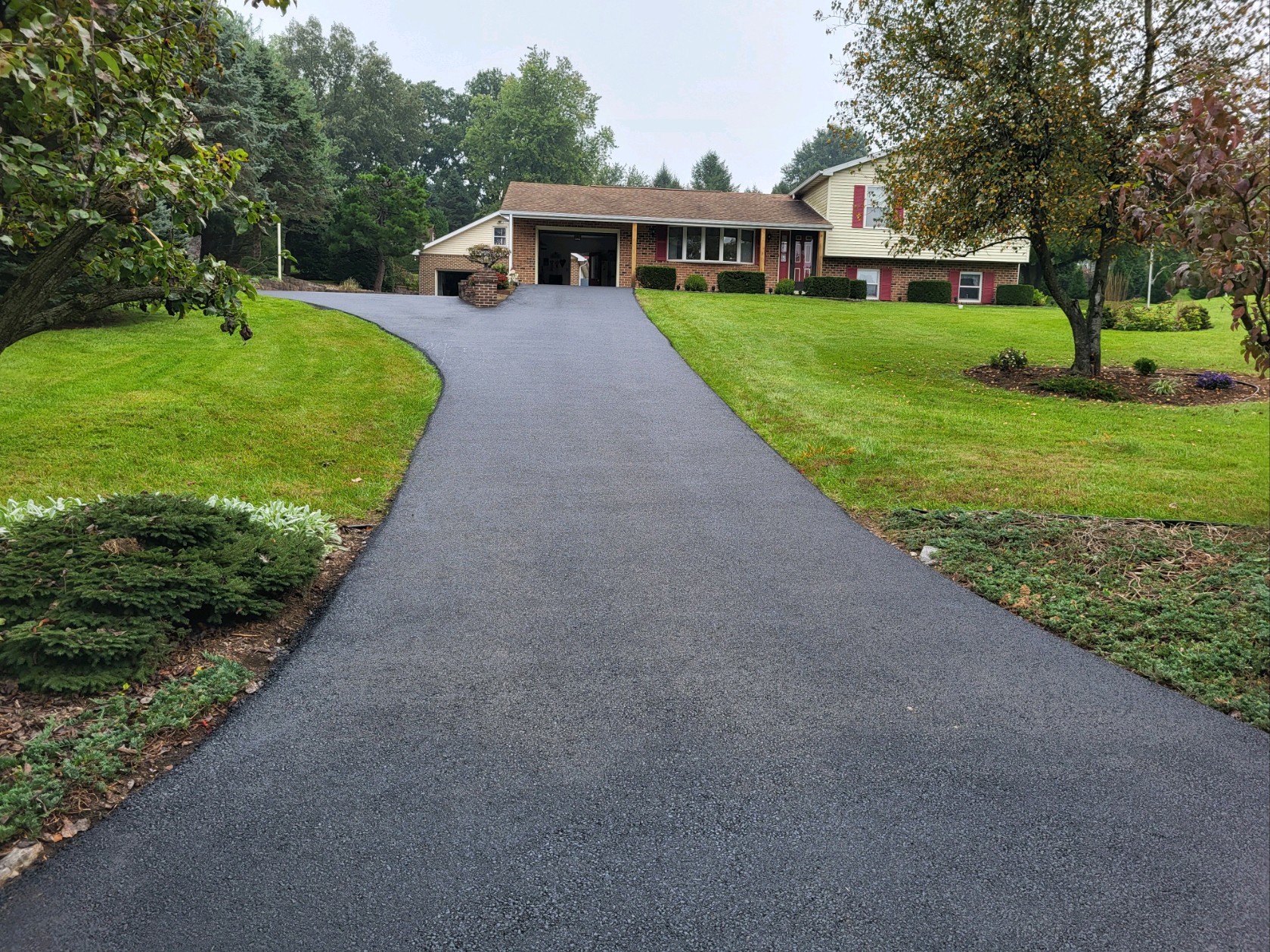 Resurfaced asphalt driveway. Residential project in Middletown.