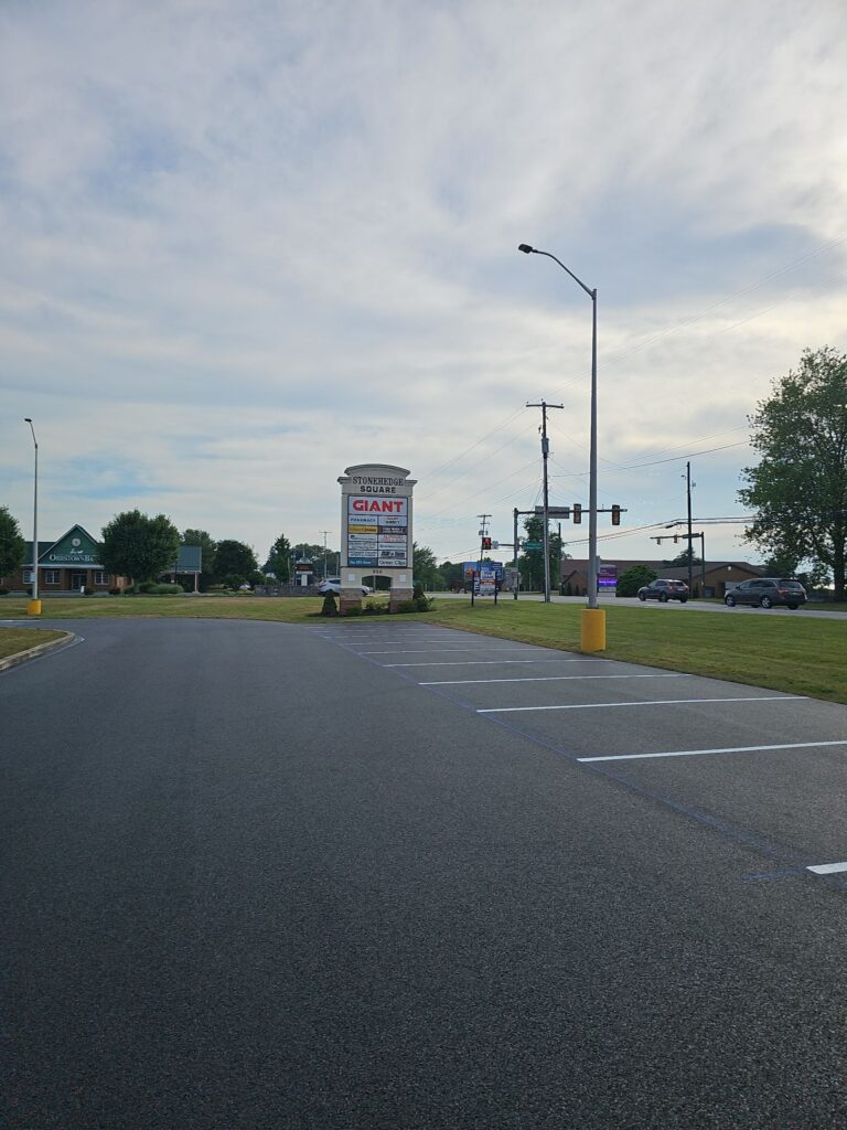 Parking lot for Stonehedge Square shopping center. Asphalt is new and parking stalls are recently striped.